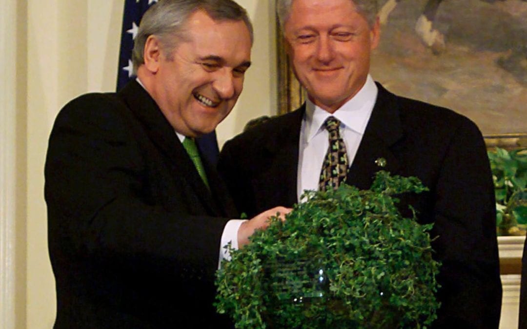 Bertie Ahern presents Bill Clinton with a bowl of shamrocks Photograph: Ron Sachs/Rex/Shutterstock